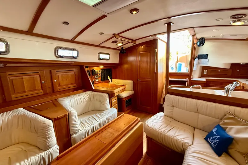 Slide: The Image of Luxurious interior of 2015 Tartan 4000 yacht with elegant wood finish and plush seating. - 15