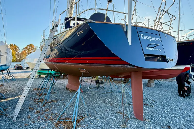 Slide: The Image of Sailboat Tartan 4000, 2015 model, on stands at a boatyard, Grace Harbor, NC. - 8