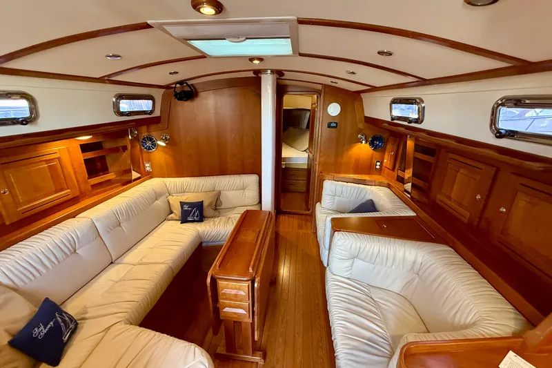 Slide: The Image of Luxurious interior of 2015 Tartan 4000 yacht with elegant wood finish and plush seating. - 9