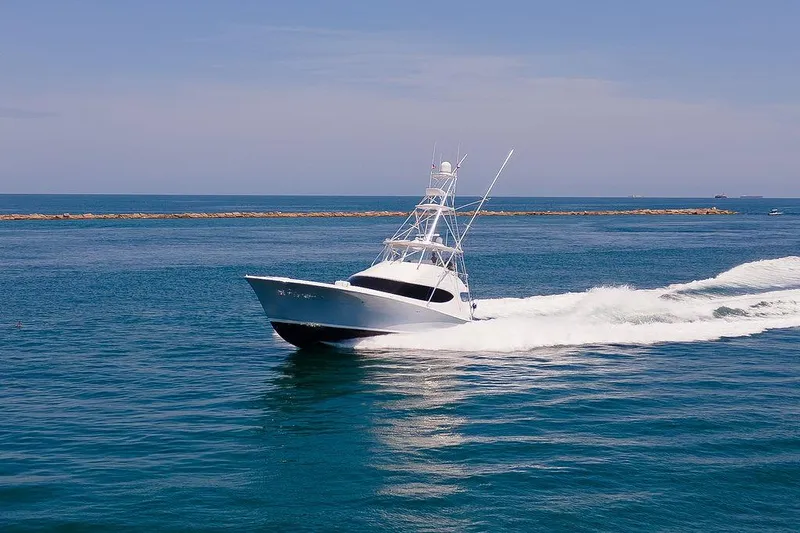 Slide: The Image of 2014 Hatteras 63 GT yacht cruising on open water. - 0