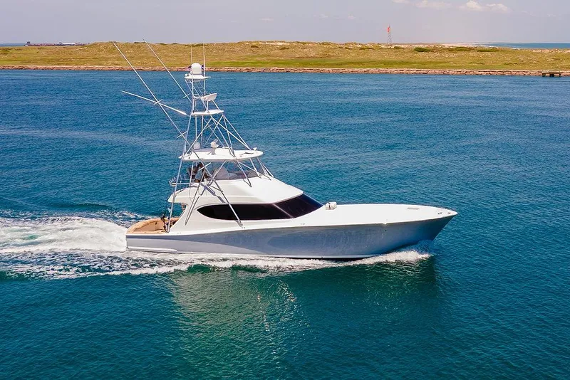 Slide: The Image of 2014 Hatteras 63 GT yacht cruising on open water. - 1