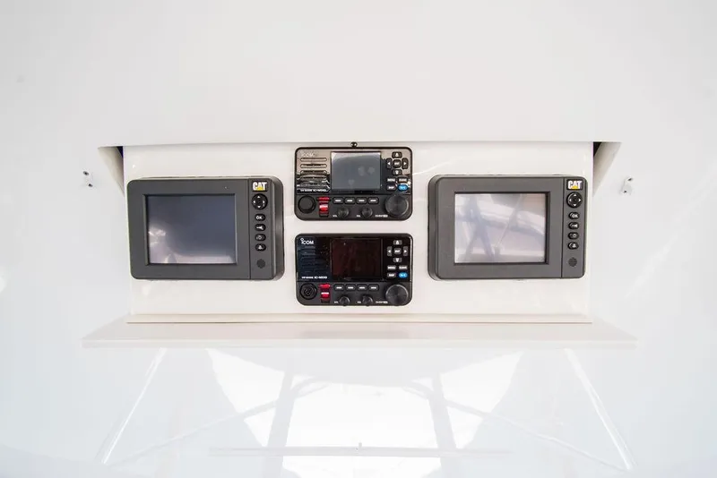 Slide: The Image of Hatteras 63 GT 2014 dashboard with navigation and control screens. - 14