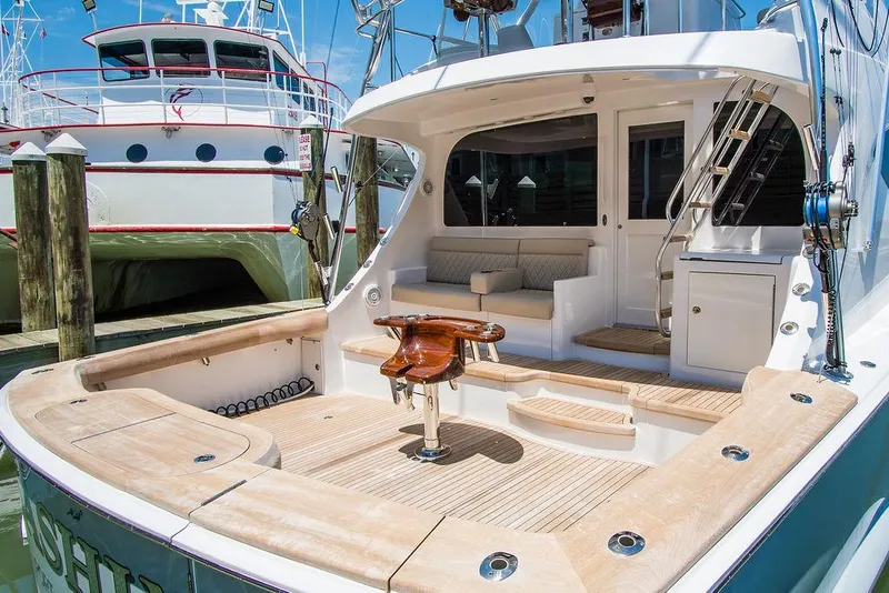 Slide: The Image of Luxurious 2014 Hatteras 63 GT yacht with spacious deck and seating area. - 18