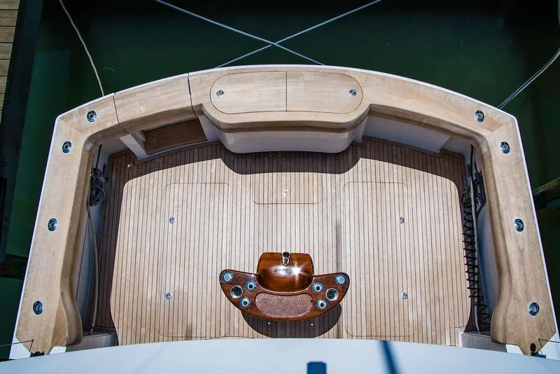 Slide: The Image of Aerial view of 2014 Hatteras 63 GT yacht deck with wood finish. - 32