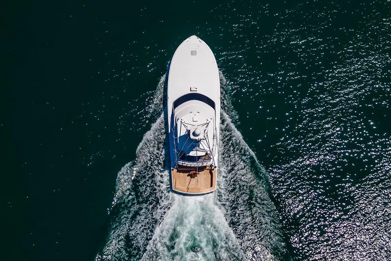 Slide: The Image of Aerial view of 2014 Hatteras 63 GT yacht cruising on open water. - 4