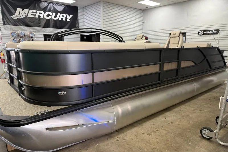 The Image of 2026 Bentley Pontoons Legacy 243 Swingback in showroom, featuring sleek design and luxurious seating. - 0