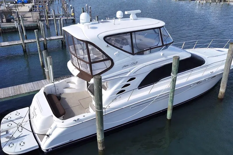 The Image of 2001 Sea Ray 560 Sedan Bridge yacht docked at marina. - 0