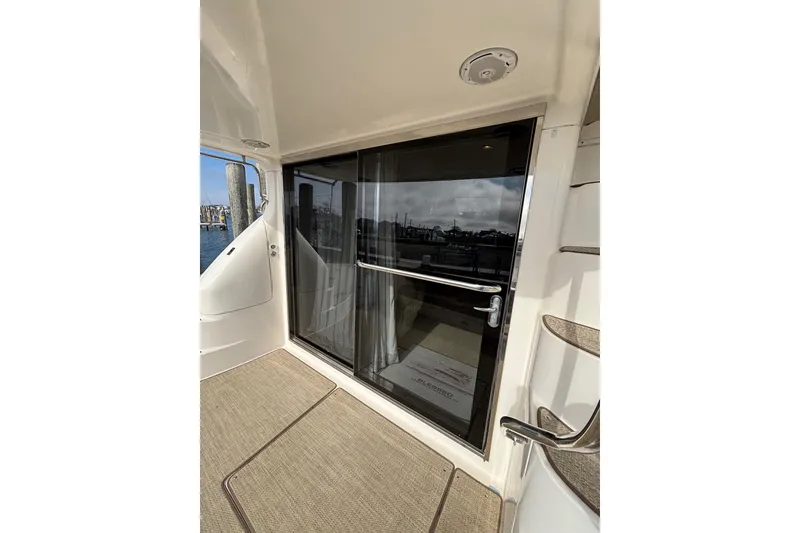 Slide: The Image of 2001 Sea Ray 560 Sedan Bridge yacht with sliding glass door and exterior staircase. - 10