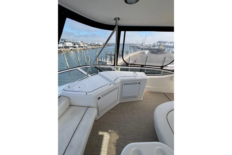 Slide: The Image of Interior view of 2001 Sea Ray 560 Sedan Bridge yacht at marina. - 16