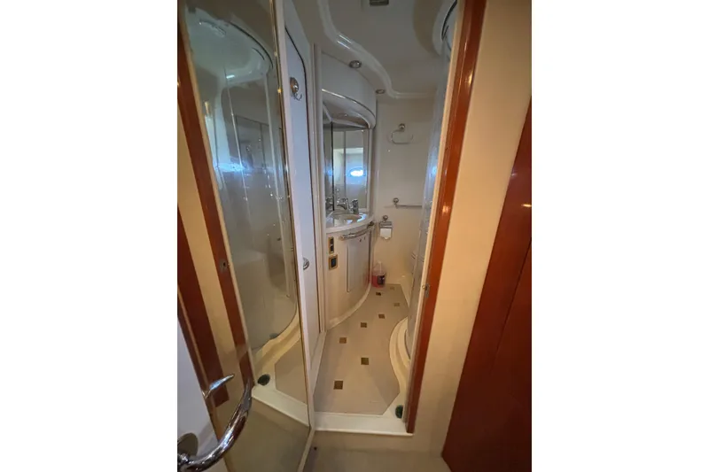 Slide: The Image of 2001 Sea Ray 560 Sedan Bridge yacht bathroom with shower and sink. - 25