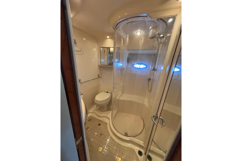 Slide: The Image of Bathroom interior of 2001 Sea Ray 560 Sedan Bridge yacht with shower and toilet. - 27