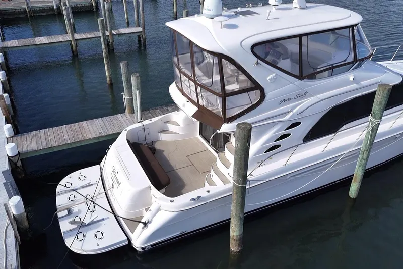 Slide: The Image of 2001 Sea Ray 560 Sedan Bridge yacht docked at marina, aerial view. - 3