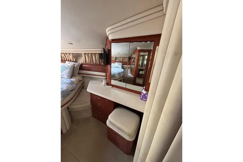 Slide: The Image of Interior of 2001 Sea Ray 560 Sedan Bridge yacht with vanity and bed. - 30