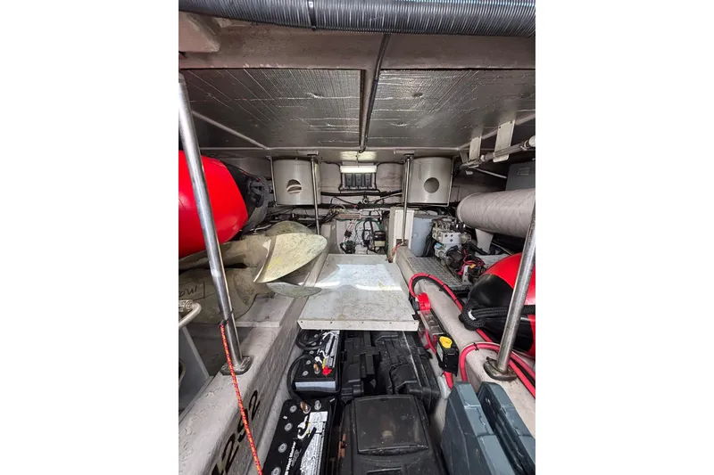 Slide: The Image of Engine room of 2001 Sea Ray 560 Sedan Bridge, showcasing mechanical components and equipment. - 35