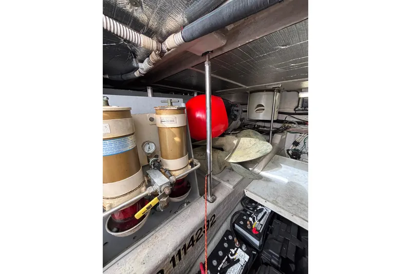 Slide: The Image of Engine room of 2001 Sea Ray 560 Sedan Bridge with mechanical components and wiring. - 37