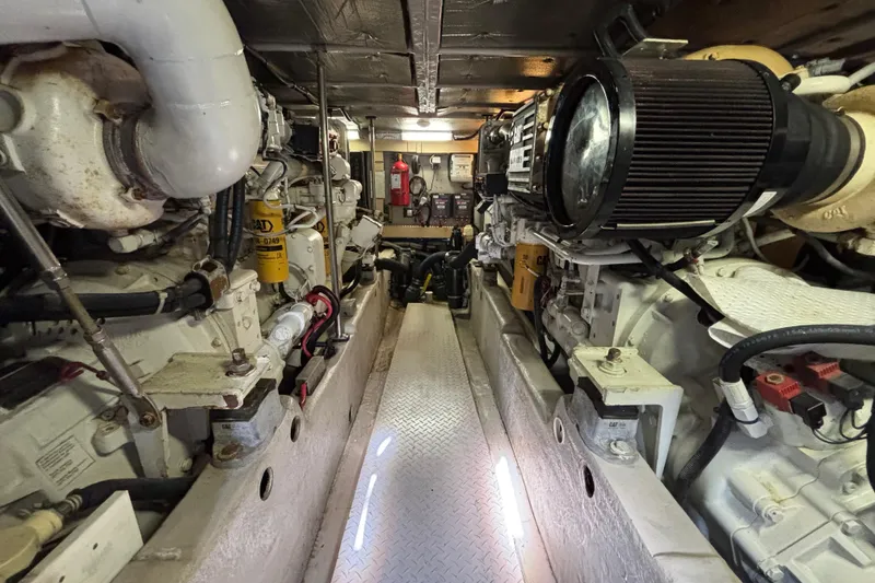 Slide: The Image of Engine room of a 2001 Sea Ray 560 Sedan Bridge yacht, showcasing machinery and components. - 38