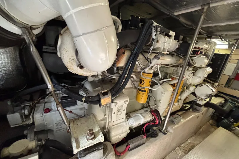 Slide: The Image of Engine room of a 2001 Sea Ray 560 Sedan Bridge yacht, showcasing mechanical components. - 40