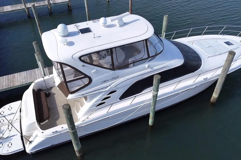 Slide: The Image of 2001 Sea Ray 560 Sedan Bridge yacht docked at marina, aerial view. - 47