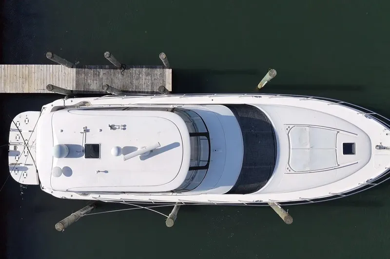 Slide: The Image of Aerial view of a 2001 Sea Ray 560 Sedan Bridge yacht docked at a pier. - 6