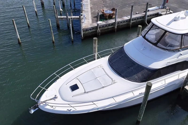 Slide: The Image of 2001 Sea Ray 560 Sedan Bridge yacht docked at marina, aerial view. - 7