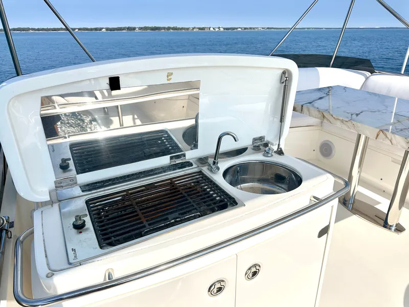 Slide: The Image of Viking Princess F54 Flybridge 2009 with grill and sink on deck. - 13
