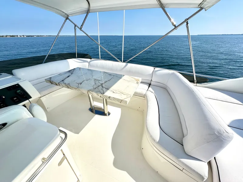 Slide: The Image of Viking Princess F54 Flybridge 2009 with marble table and ocean view. - 15