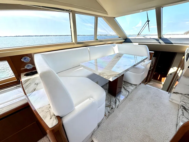 Slide: The Image of Luxurious interior of 2009 Viking Princess F54 flybridge with marble table. - 24