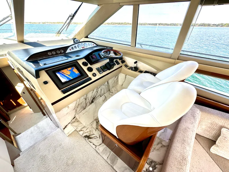 Slide: The Image of Interior of 2009 Viking Princess F54 flybridge with helm console. - 27