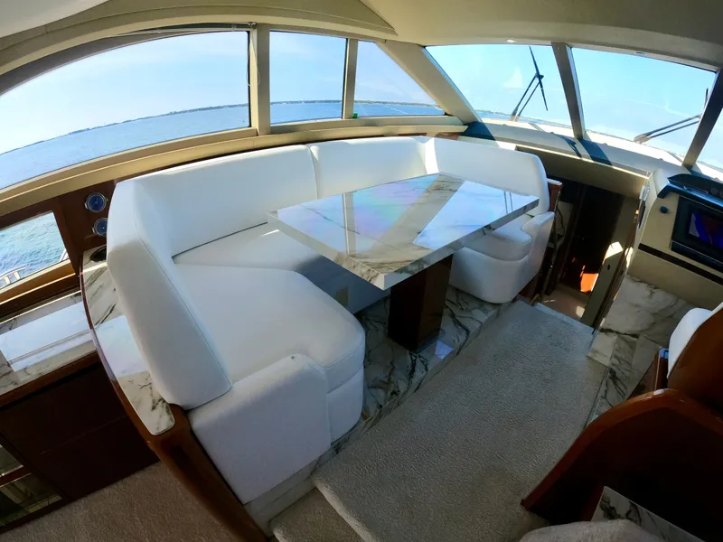 Slide: The Image of Luxurious interior of 2009 Viking Princess F54 flybridge with marble table. - 29