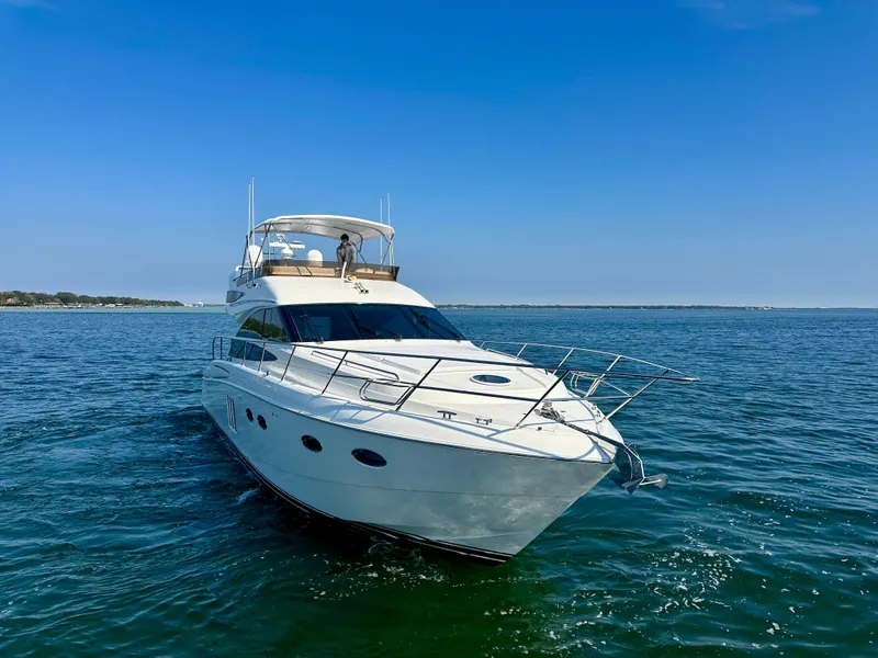 Slide: The Image of 2009 Viking Princess F54 Flybridge yacht on open sea. - 3