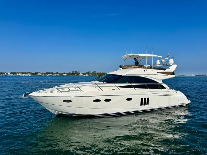 Slide: The Image of 2009 Viking Princess F54 Flybridge yacht on calm waters. - 5