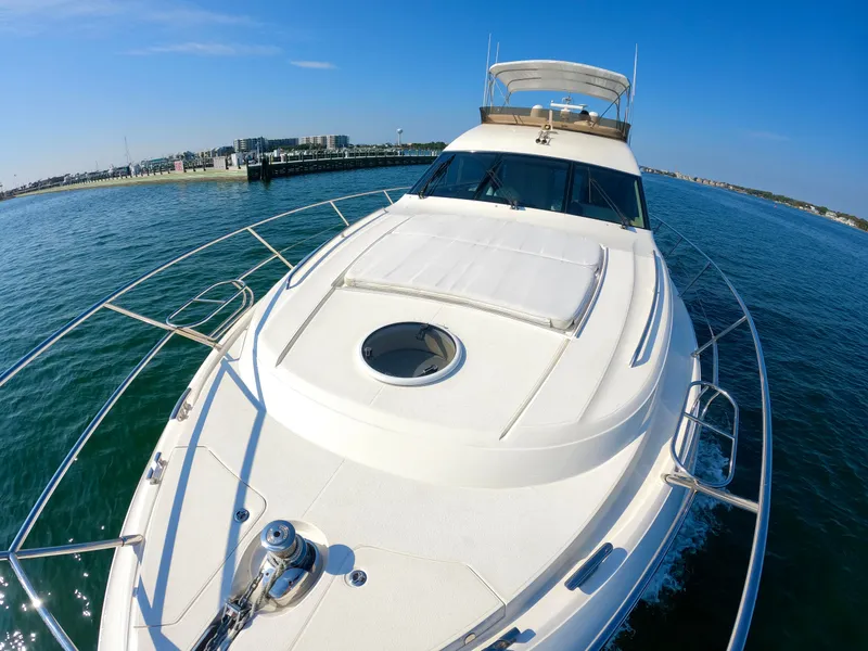 Slide: The Image of 2009 Viking Princess F54 Flybridge yacht cruising on open water. - 9