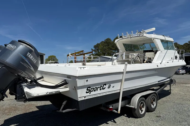 Slide: The Image of 2007 Sport-Craft 302 Sport Fish boat on trailer with Yamaha outboard motor. - 3