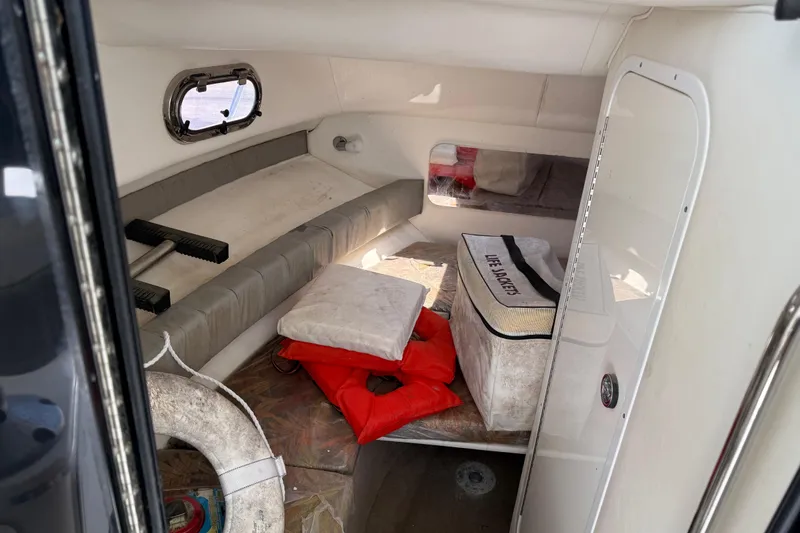 Slide: The Image of Interior cabin of 2007 Sport-Craft 302 Sport Fish boat with life jackets and seating. - 4
