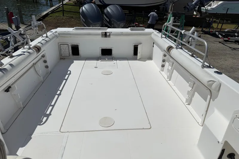 Slide: The Image of 2007 Sport-Craft 302 Sport Fish boat deck with spacious layout and dual Yamaha engines. - 6