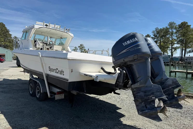 Slide: The Image of 2007 Sport-Craft 302 Sport Fish boat with twin Yamaha outboard motors on a trailer. - 8