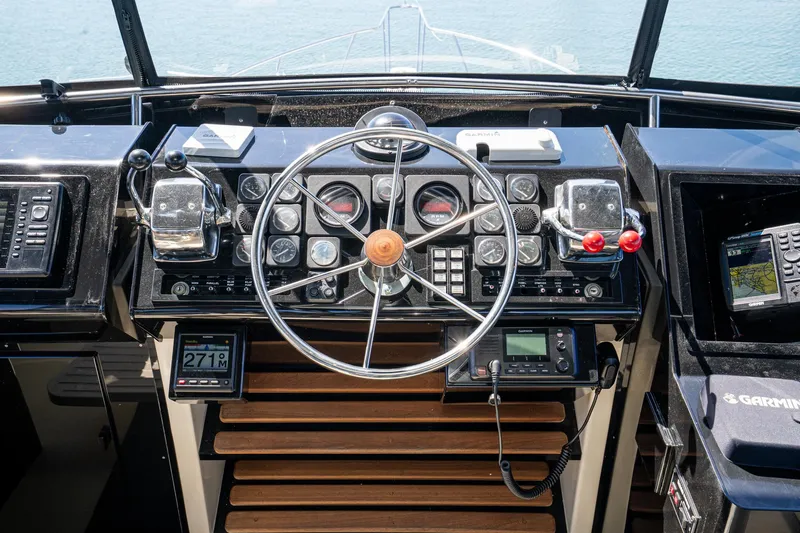 Slide: The Image of Cockpit of 1989 Californian 48 Cockpit Motor Yacht with steering wheel and navigation instruments. - 24