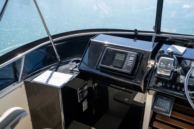 Slide: The Image of Cockpit of 1989 Californian 48 Cockpit Motor Yacht with navigation equipment and controls. - 25