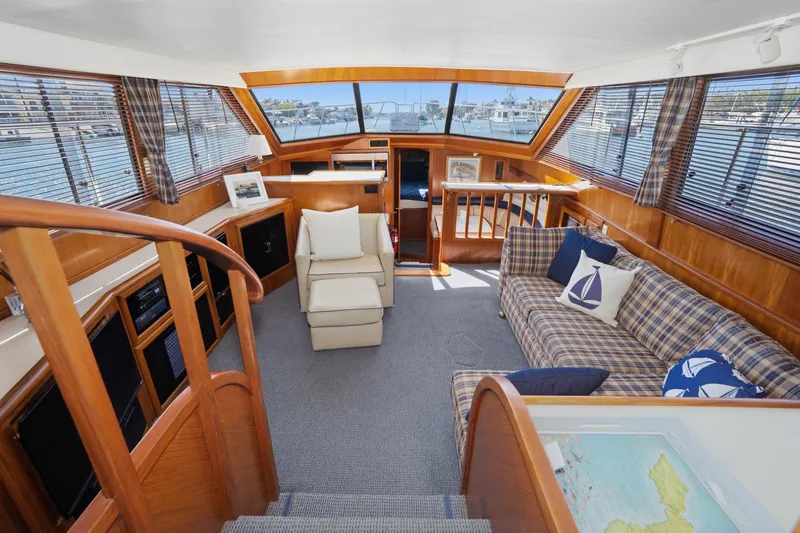 Slide: The Image of Luxurious interior of 1989 Californian 48 Cockpit Motor Yacht with elegant wood finishes. - 34