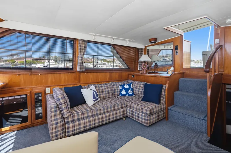 Slide: The Image of Interior of 1989 Californian 48 Cockpit Motor Yacht with plaid sofa and nautical decor. - 36