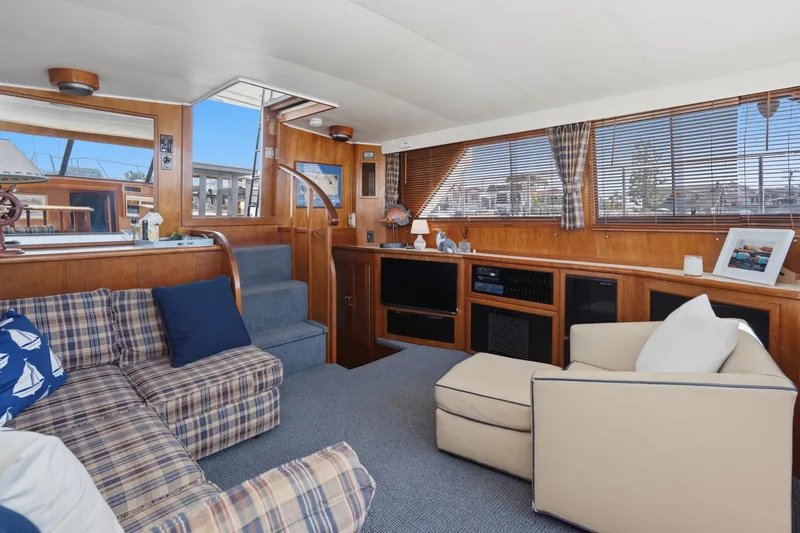 Slide: The Image of Interior of 1989 Californian 48 Cockpit Motor Yacht with cozy seating and nautical decor. - 37