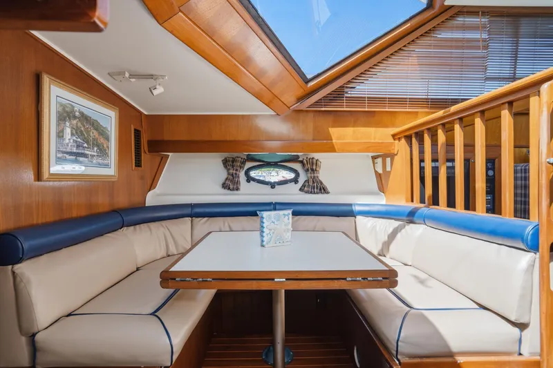 Slide: The Image of Interior of 1989 Californian 48 Cockpit Motor Yacht with cozy dining area and skylight. - 45