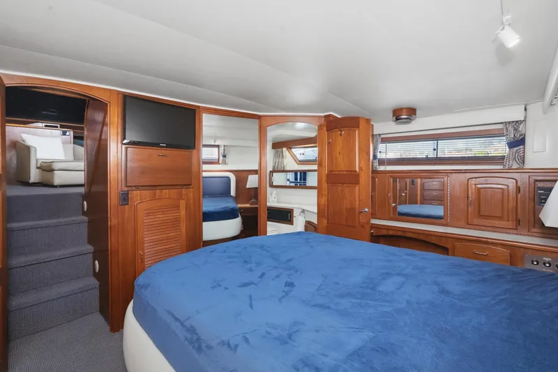 Slide: The Image of Luxurious cabin interior of 1989 Californian 48 Cockpit Motor Yacht with wood finishes. - 51