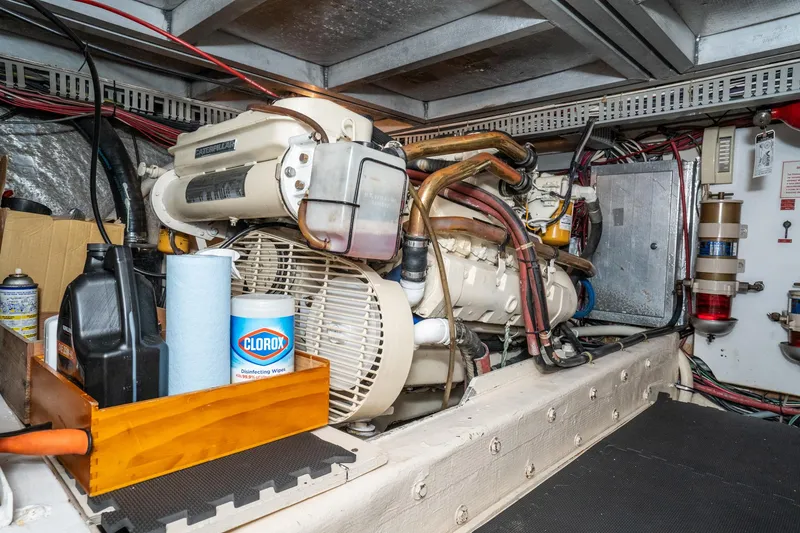 Slide: The Image of Engine room of 1989 Californian 48 Cockpit Motor Yacht with maintenance supplies. - 64