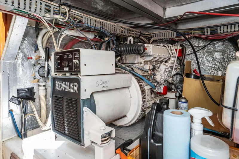 Slide: The Image of Engine room of 1989 Californian 48 Cockpit Motor Yacht with Kohler generator. - 66