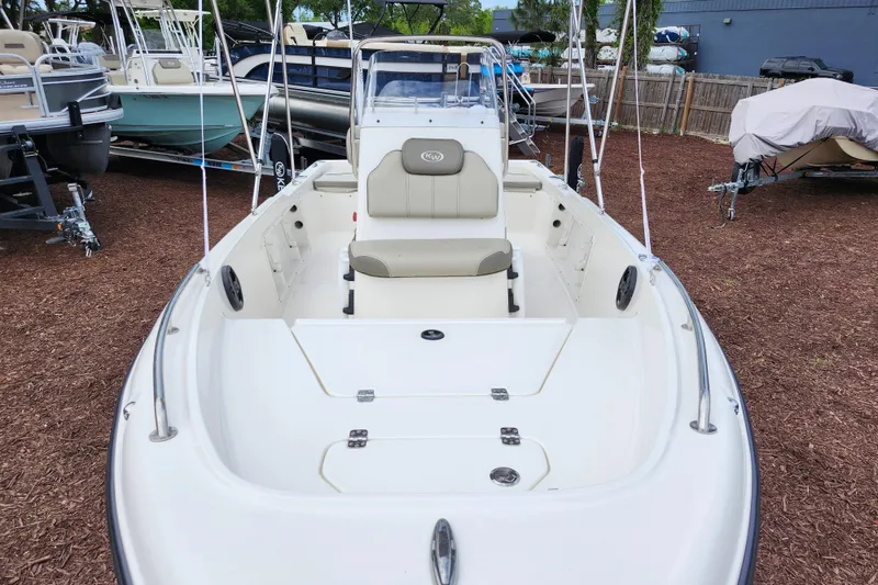 Slide: The Image of 2024 Key West 1720 Center Console boat displayed outdoors on mulch. - 10