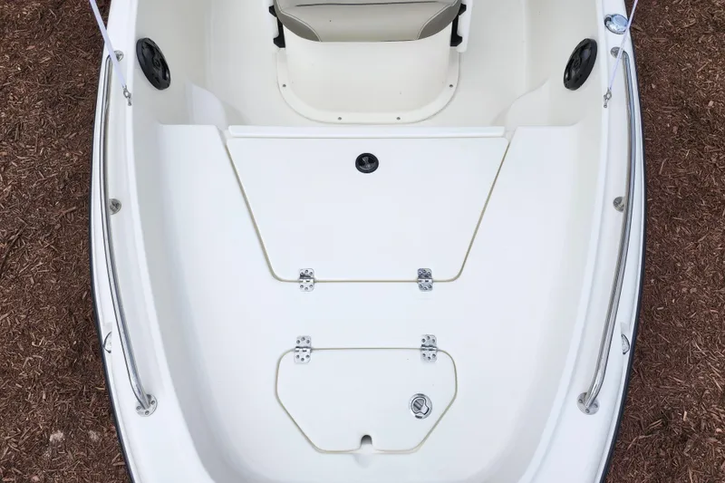 Slide: The Image of 2024 Key West 1720 Center Console boat interior, featuring storage compartments and seating area. - 14