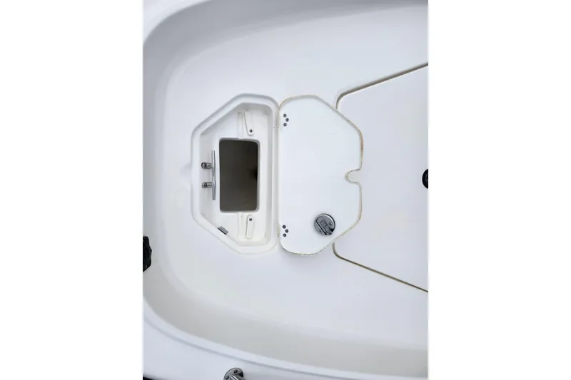 Slide: The Image of 2024 Key West 1720 Center Console boat storage compartment detail. - 15