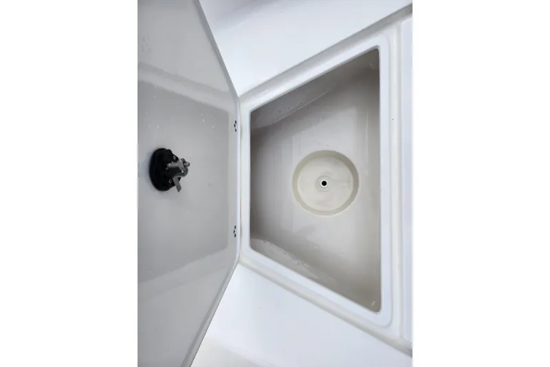 Slide: The Image of 2024 Key West 1720 Center Console boat storage compartment detail. - 16