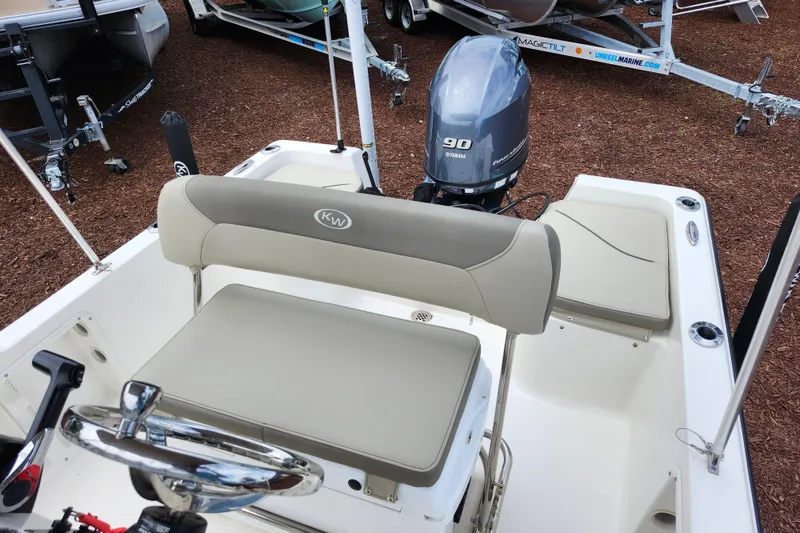 Slide: The Image of 2024 Key West 1720 Center Console boat with Yamaha 90 engine, beige seating. - 29